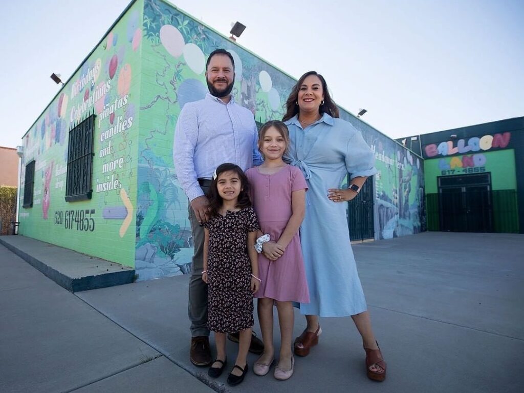 Selina Barajas with her husband and their two daughters in front of the cafe